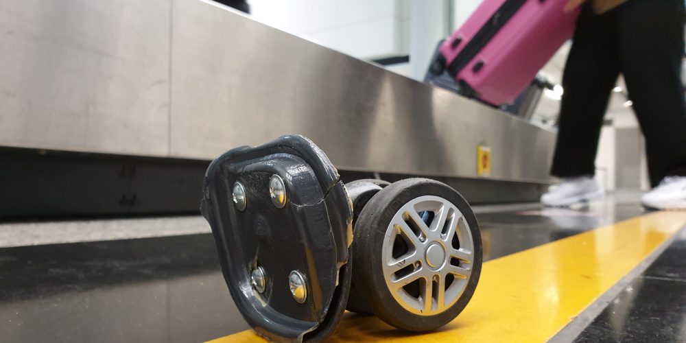 Broken bag wheel at conveyor belt