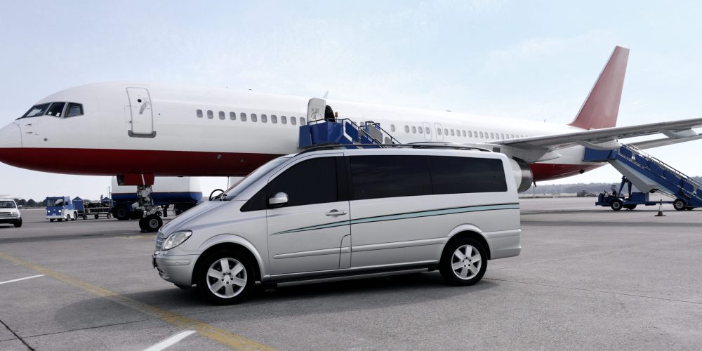 Antalya, Turkey - May 27, 2007: VIP shuttle service van on airport platform waiting beside a jumbo jet.